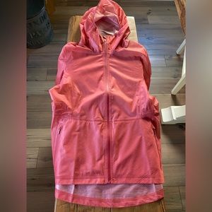 New!! Lululemon rain jacket. Light weight. Easy to pack. Size 10. Peach color.